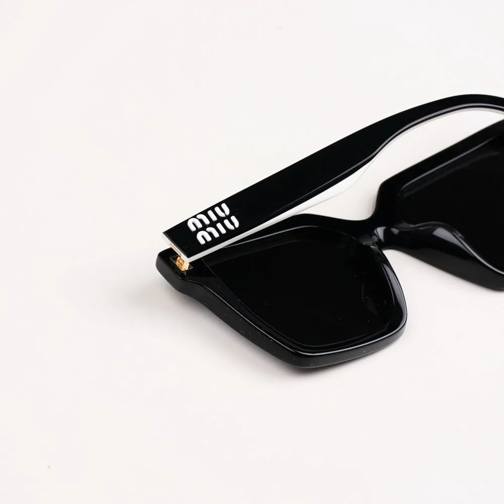 แว่น Miu Miu 03YSF 10G5S0 โลโก้